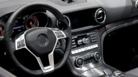 The steering wheel and dash of a vehicle
